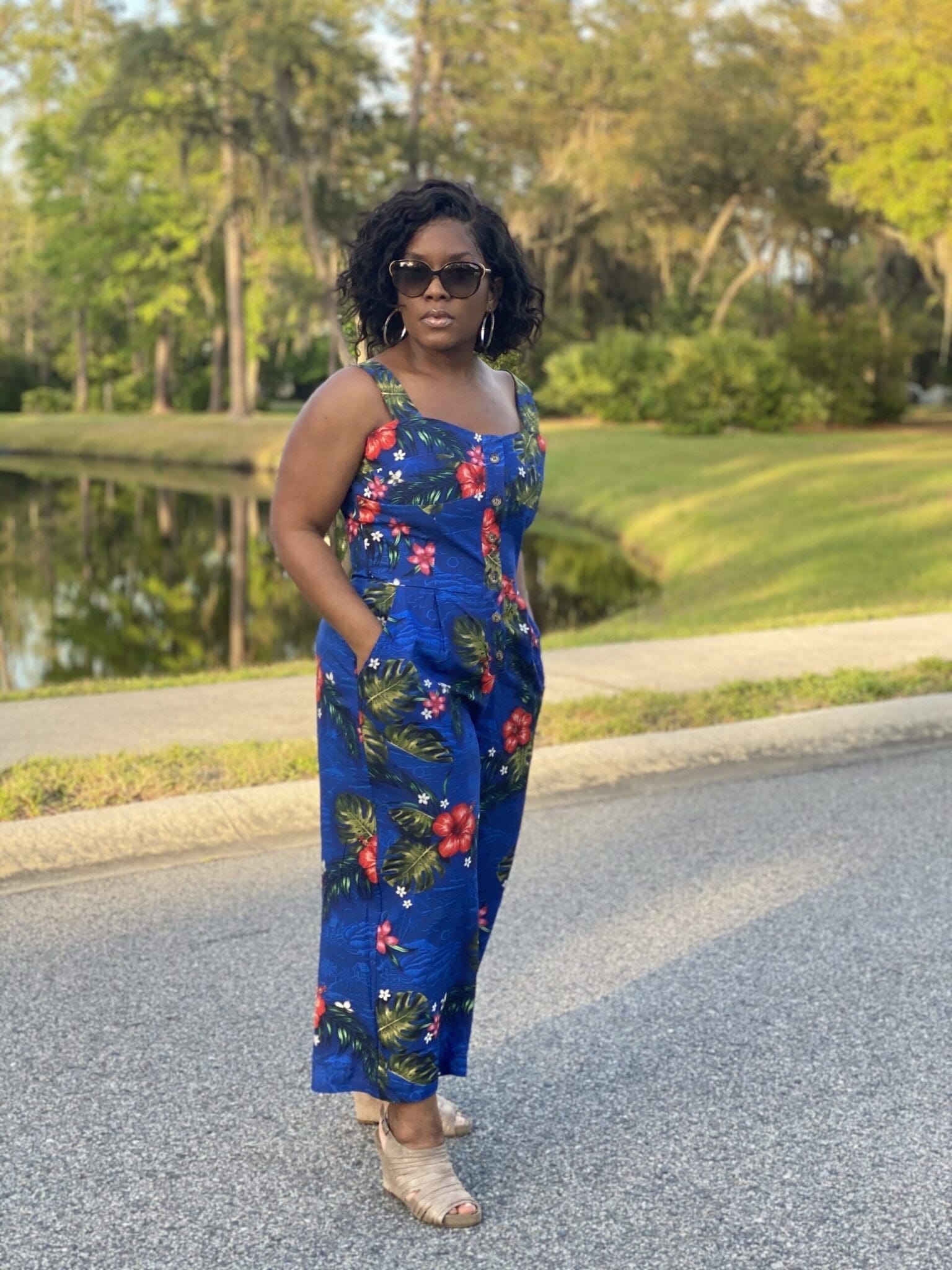 McCalls Natala jumpsuit M8101 African American woman standing the road wearing McCalls 8101 with shades on