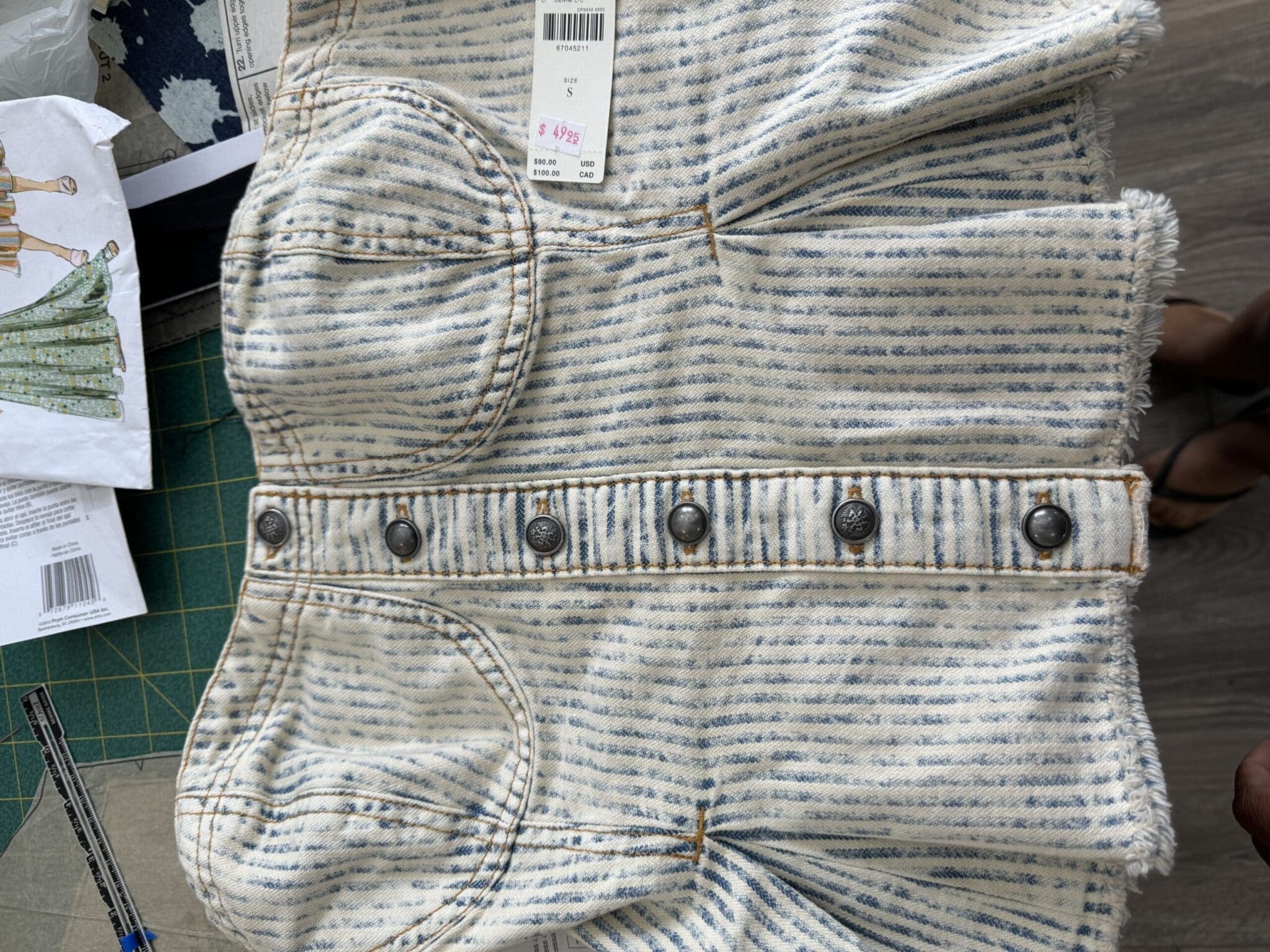Flatlay of Anthropologie strapless denim top before alterations