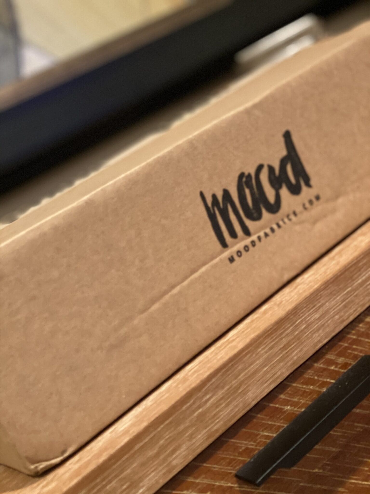 Mood fabric stores review: The iconic Mood Fabrics delivery box showcasing beautiful textile sourcing