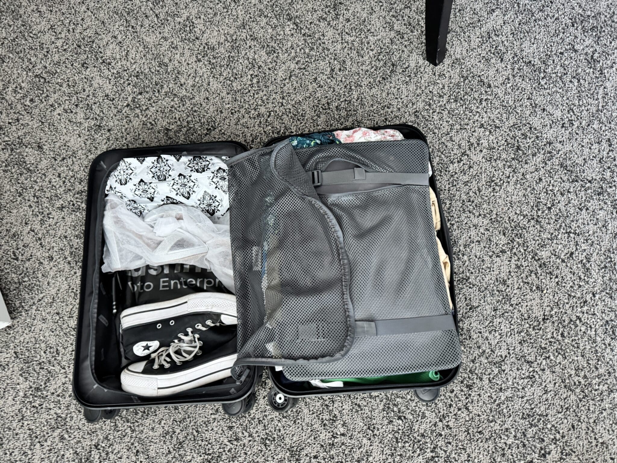 Inside the Away carry-on packed with clothes