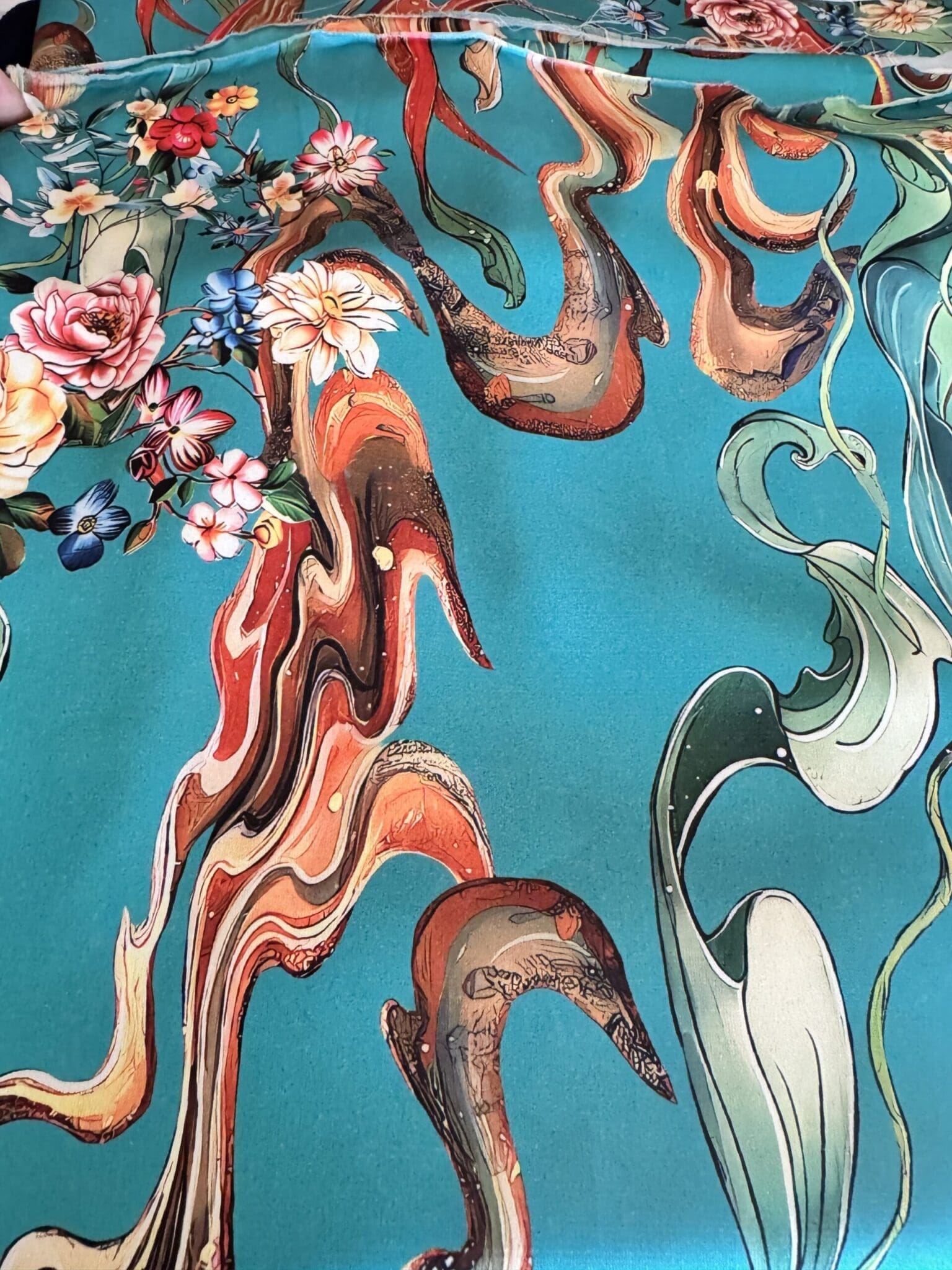 Rich teal and orange printed silk swirl fabric sourced in Paris for a bespoke petite blouse