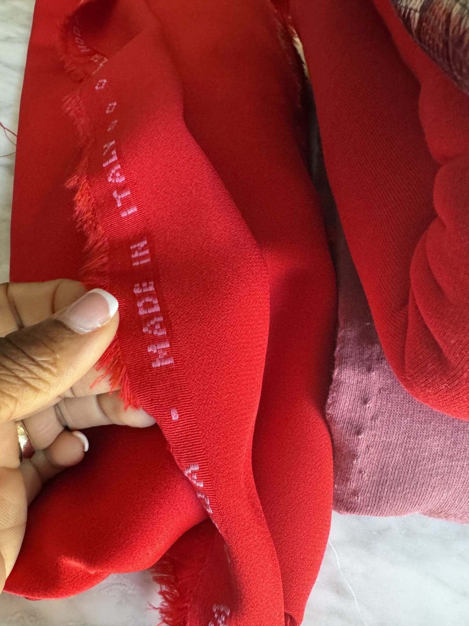 Vibrant red Italian cady fabric sourced at Les Coupons de St Pierre for a custom corporate power blazer