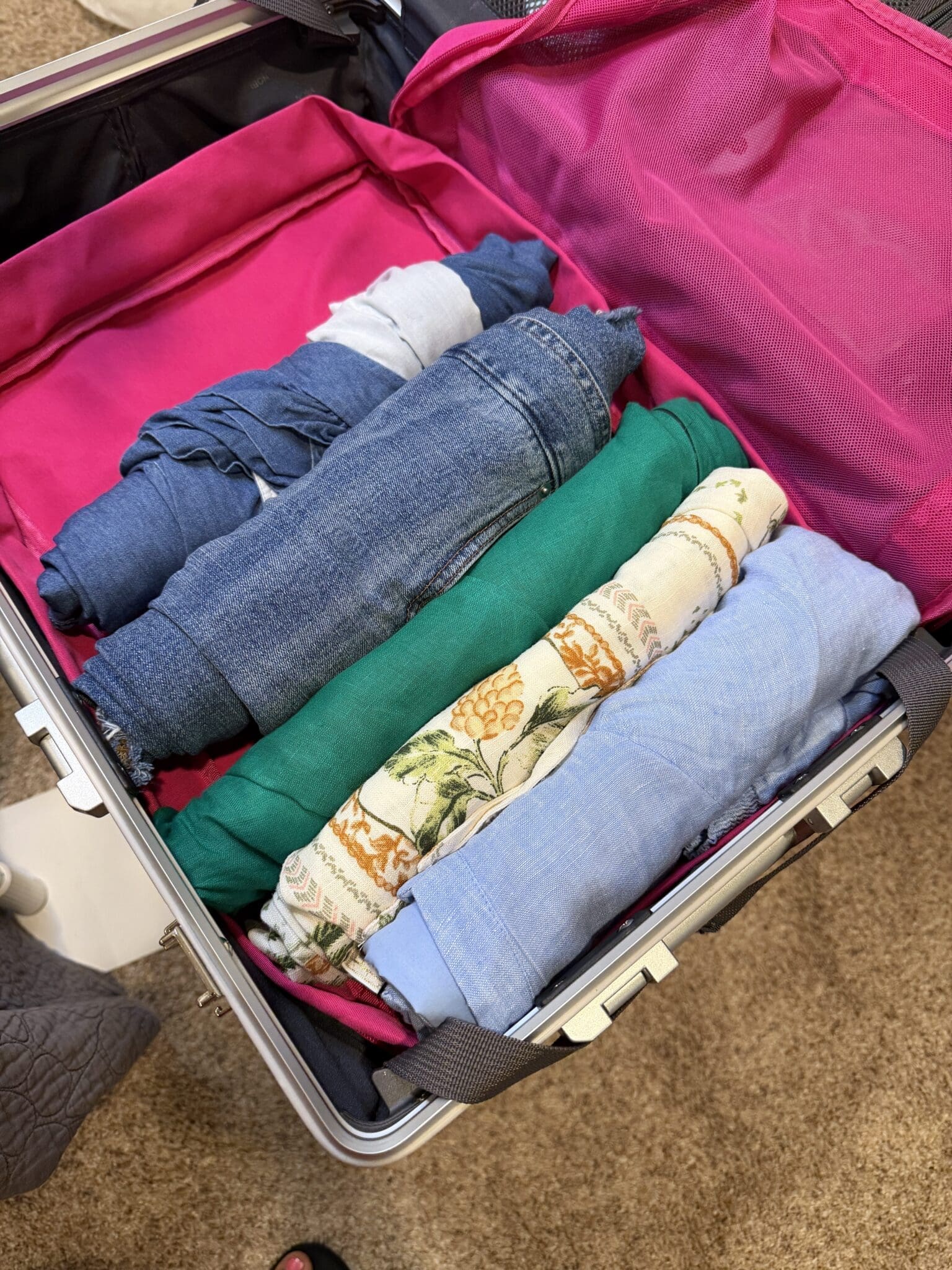 Rolled denim clothing inside large Nobl packing cube