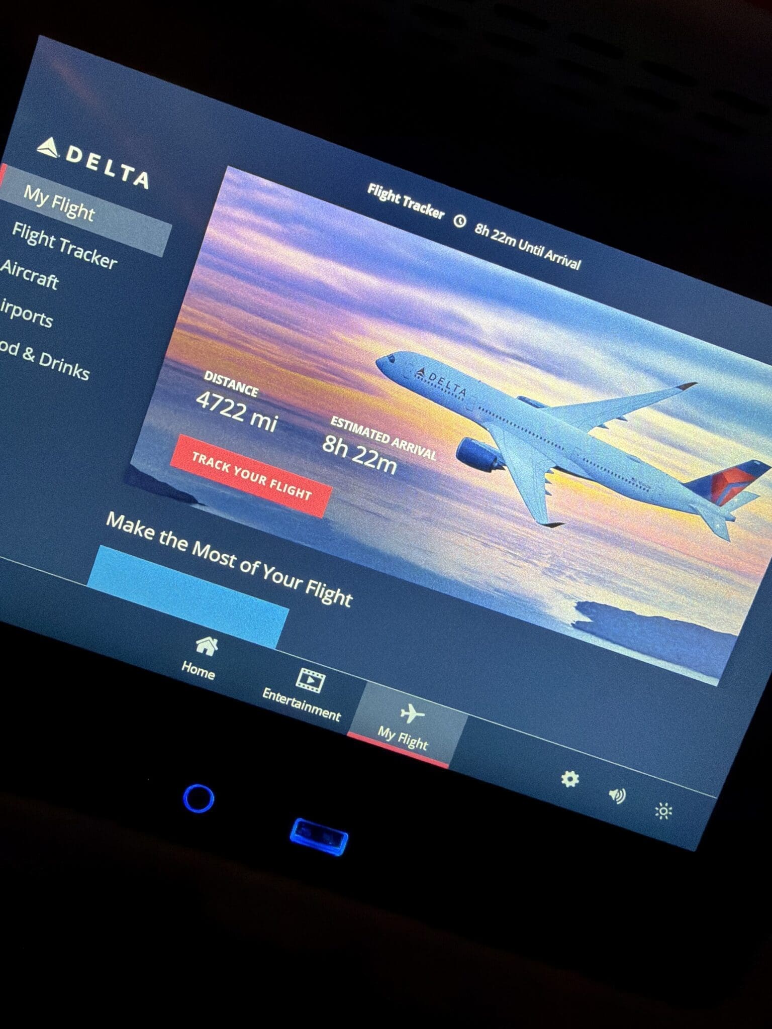 Delta airplane seatback screen showing the flight tracker with 8 hours remaining on a long-haul flight.