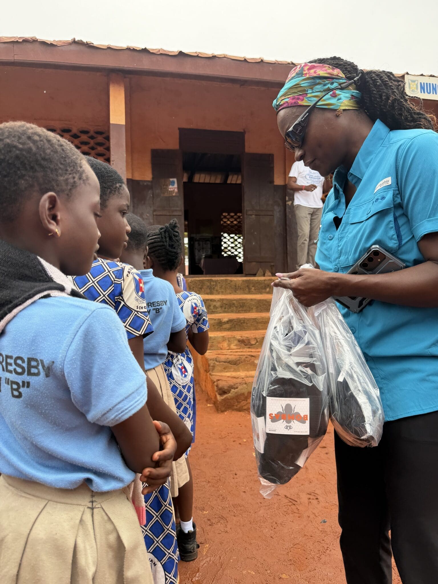 Giving out Bombas socks to children in Ghana
