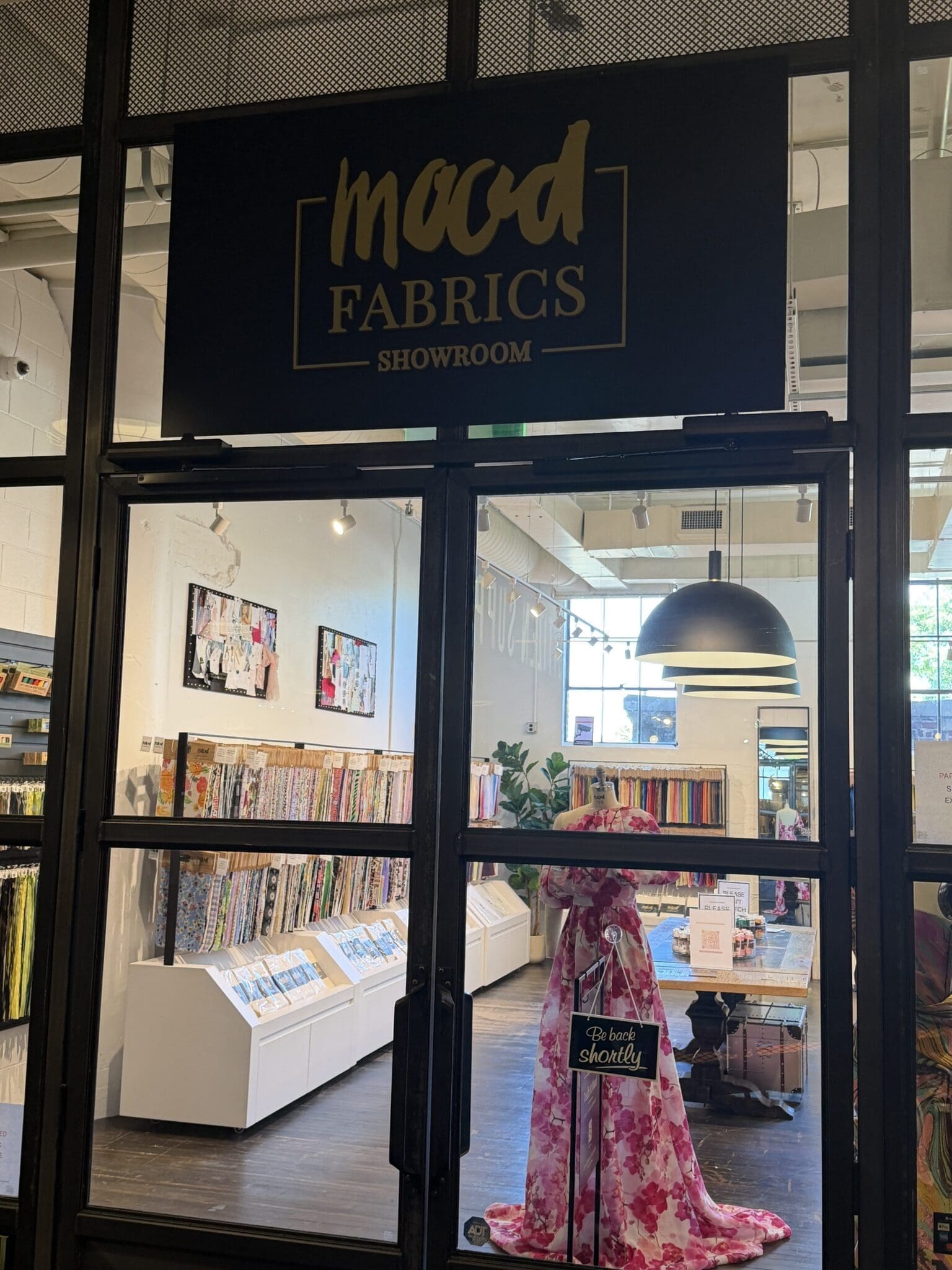 The curated storefront entrance of the Mood Fabrics Atlanta showroom at Ponce City Market, offering an exclusive and elevated textile sourcing experience.