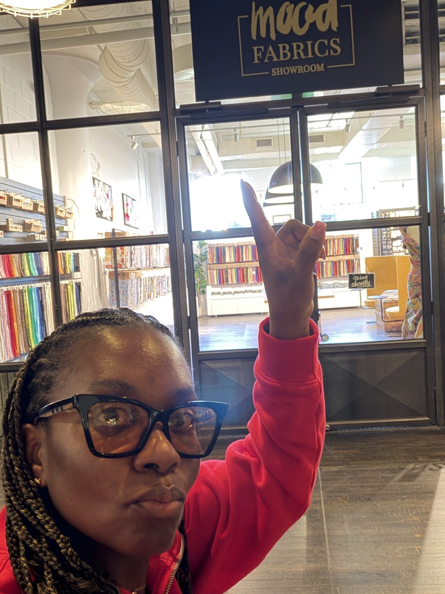 Mood fabric stores review: Rows of curated fabric swatches at Mood Fabrics Atlanta showroom