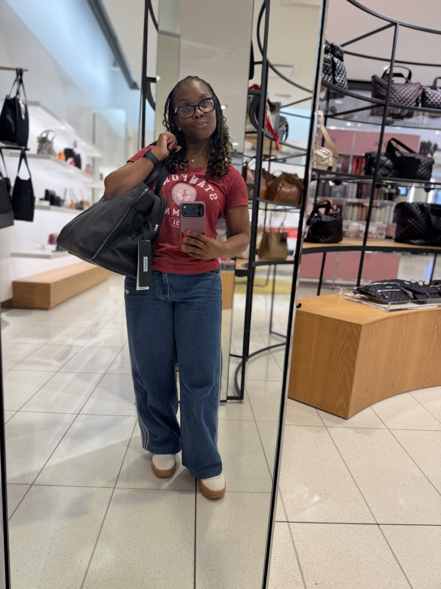 Mirror selfie showing Away Weekender scaled proportionately on a 4'11 frame
