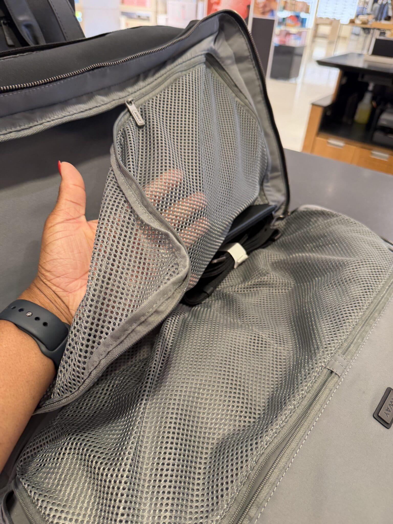 Close-up of internal pockets and organization inside the Away duffle
