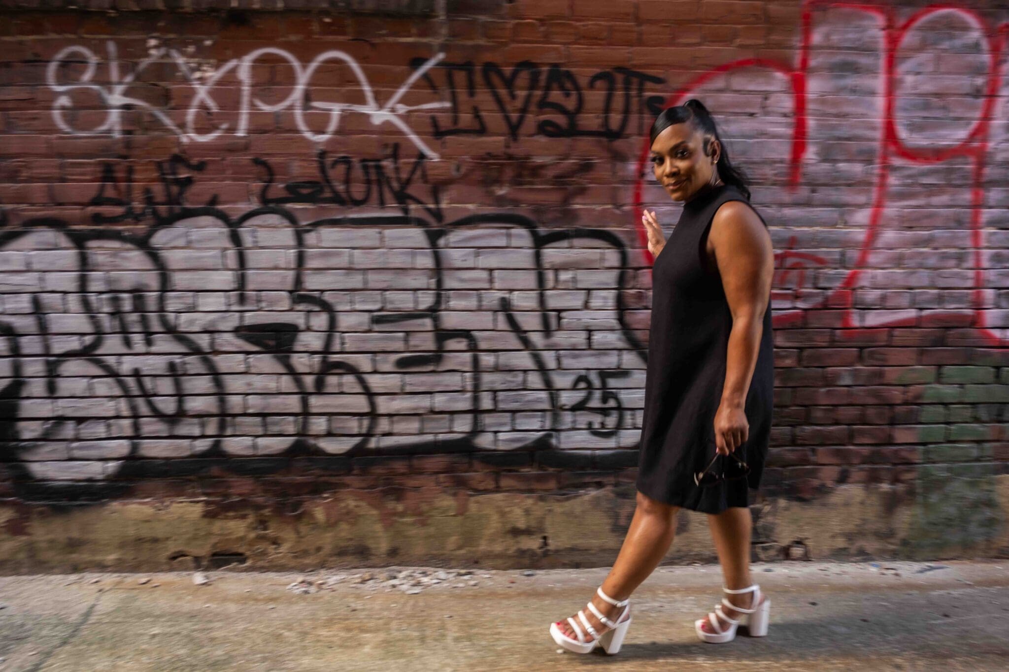 Simplicity 3230 pattern review with Dr. Shontae Buffington in a black tent dress and white platform heels