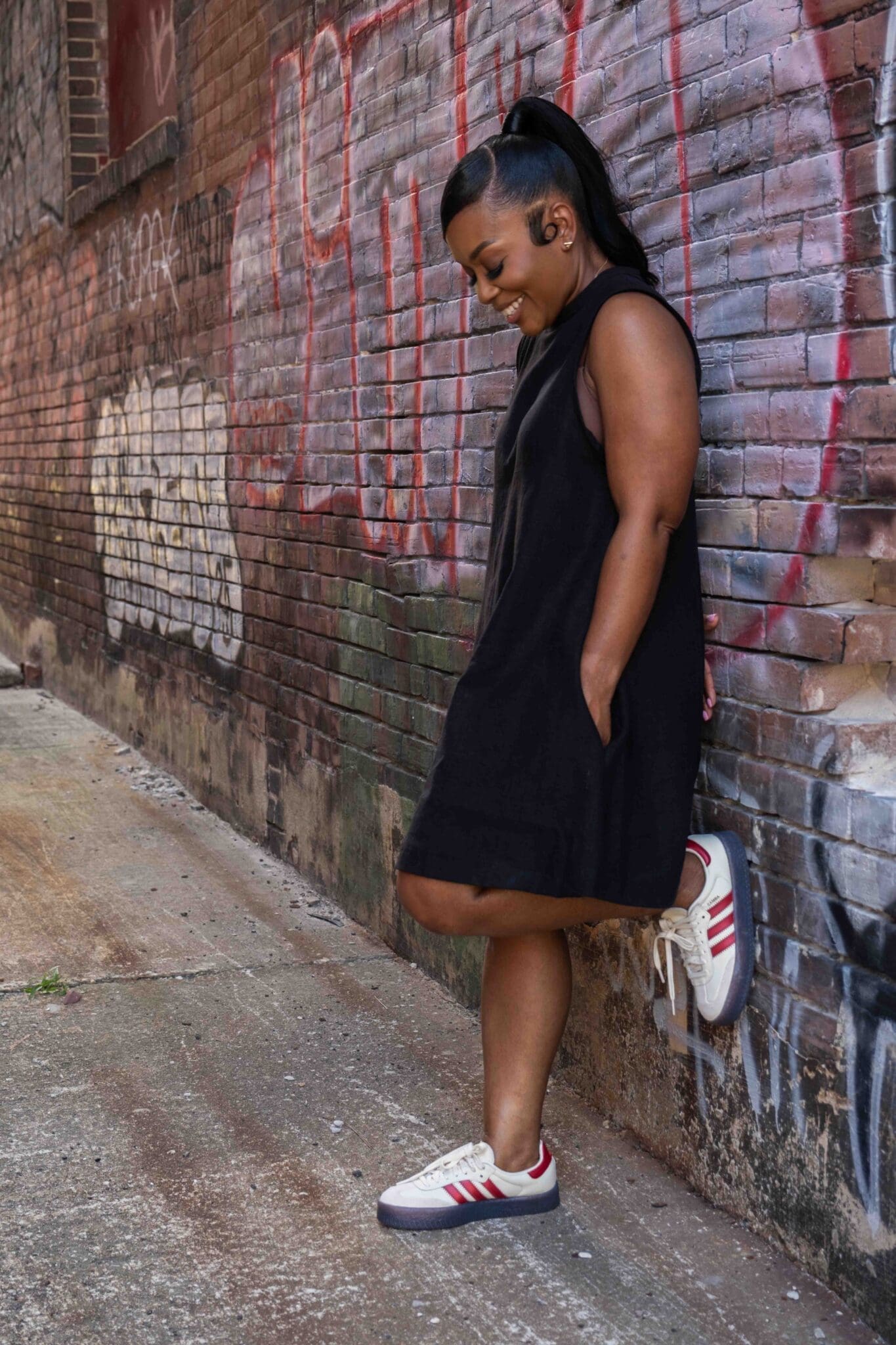 Simplicity 3230 pattern review styled casually with Adidas Sambas sneakers against brick wall
