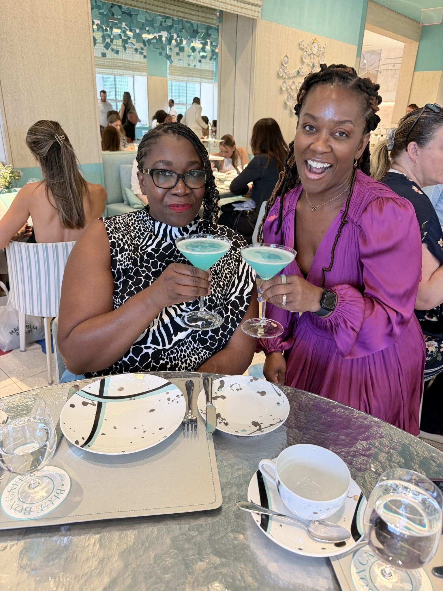 Dr. Shontae Buffington and S.R. celebrating at The Blue Box Cafe