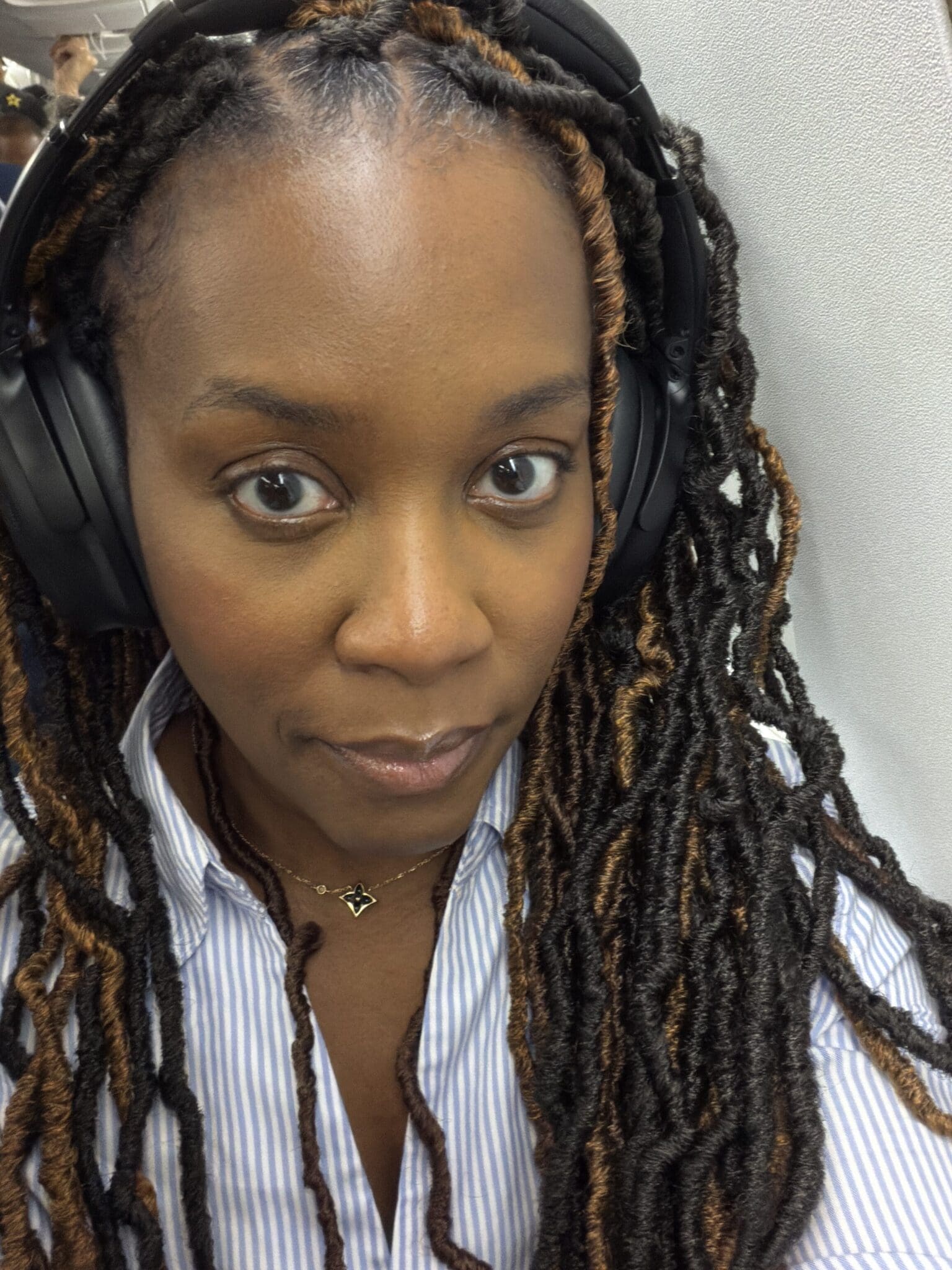 Dr. Shontae Buffington relaxing on a travel getaway with personal style and ease