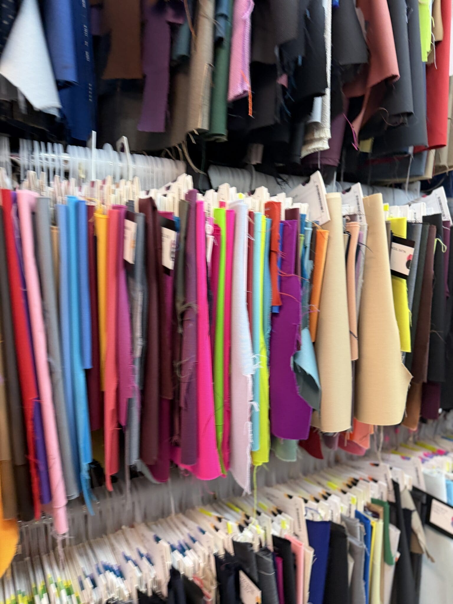 Rows of fabric swatch headers inside B and J Fabrics showroom