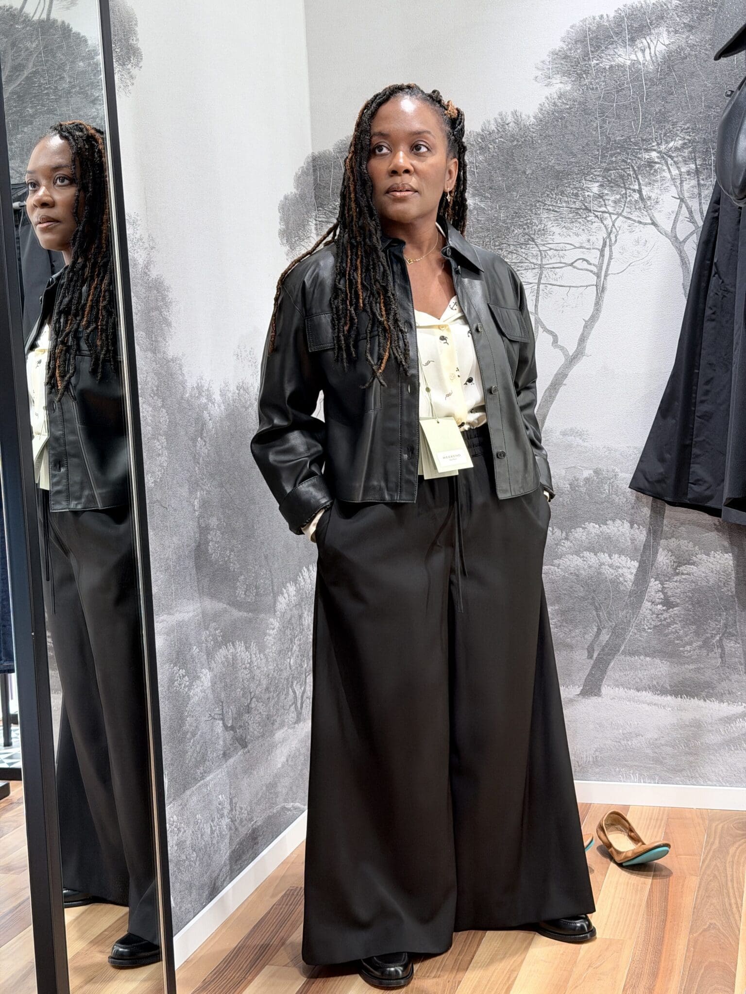 Lisbon shopping guide styling: Weekend Max Mara leather jacket, nautical silk blouse, and wide leg trousers